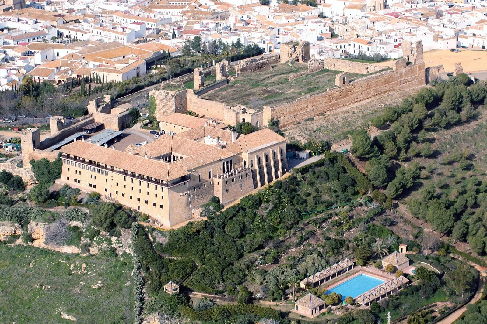 Aerial view of the Parador de Carmona, with the pool and the old town of Carmona on the hill