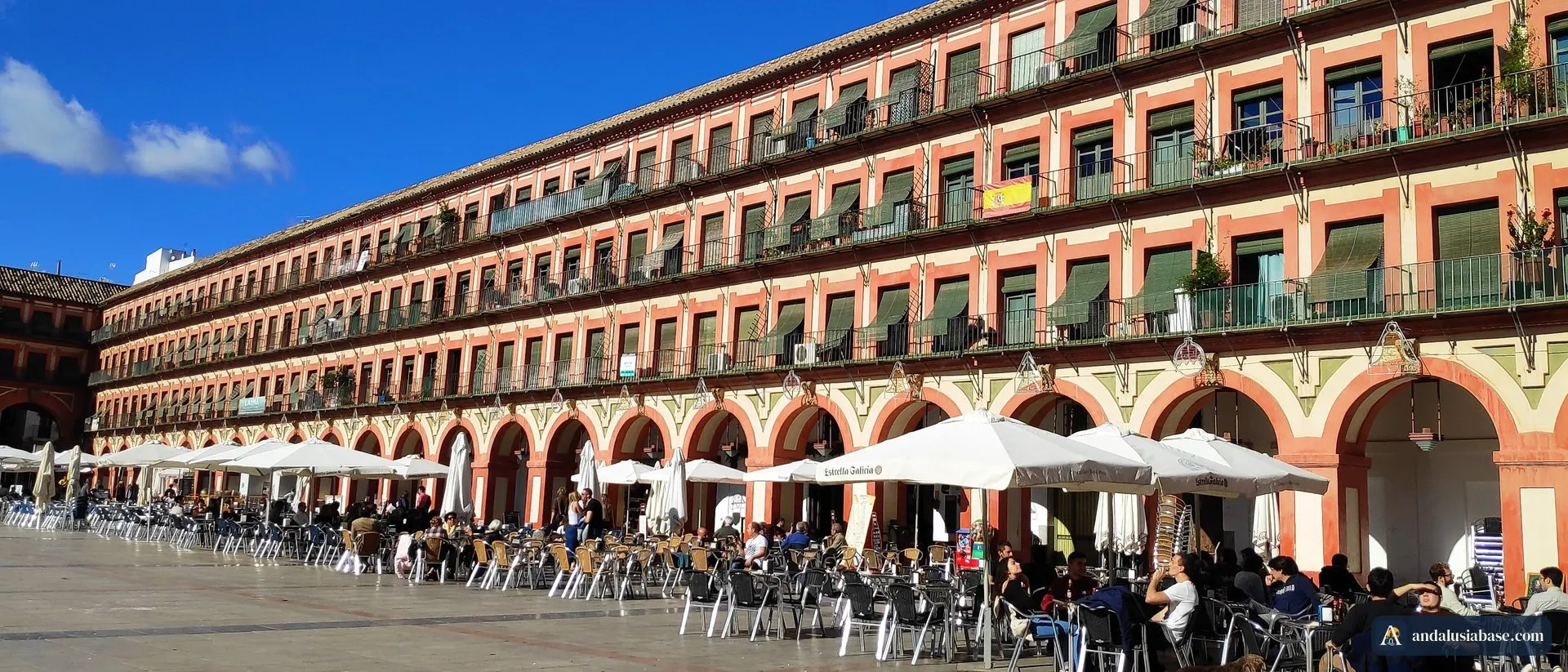 Café terraces under the arcades of Plaza de la Corredera in Córdoba